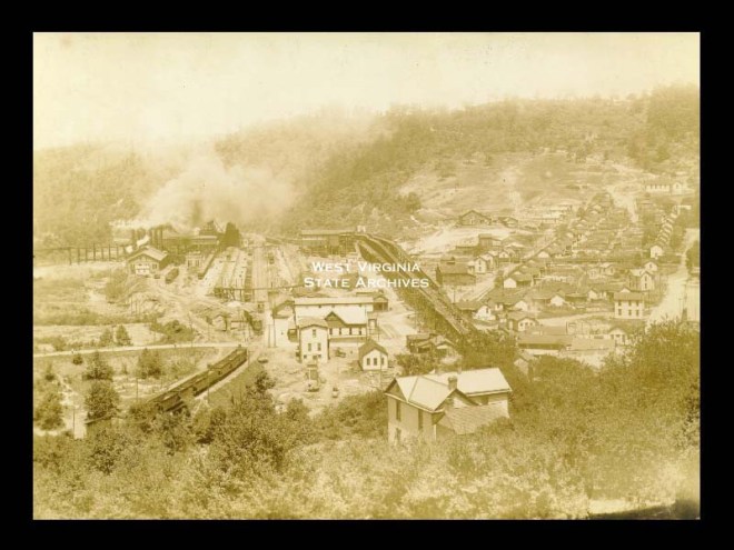 View of Monongah from hillside. Consolidation Coal Company structures, coal cars, houses.